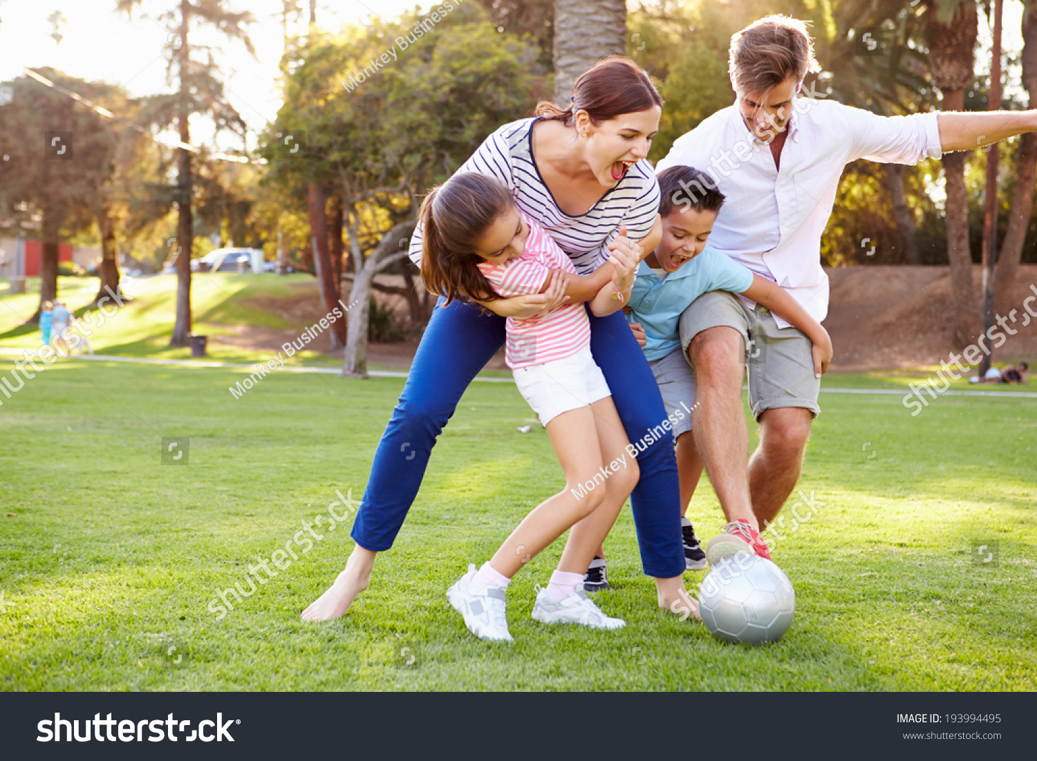 Family Playing Soccer In Park Together Stock Photo Image Of Female Family Playing Soccer In Park Together Stock Photo Image Of Female